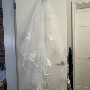 Custom-made two-tier ivory wedding veil with delicate floral lace appliqués and
